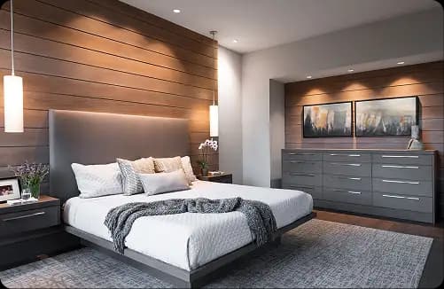 Turnkey-designed lounge with fluted wooden wall panels, ambient lighting, and sofa seating